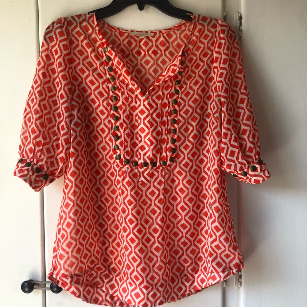 41 Hawthorn sheer orange patterned blouse with brass grommet accents